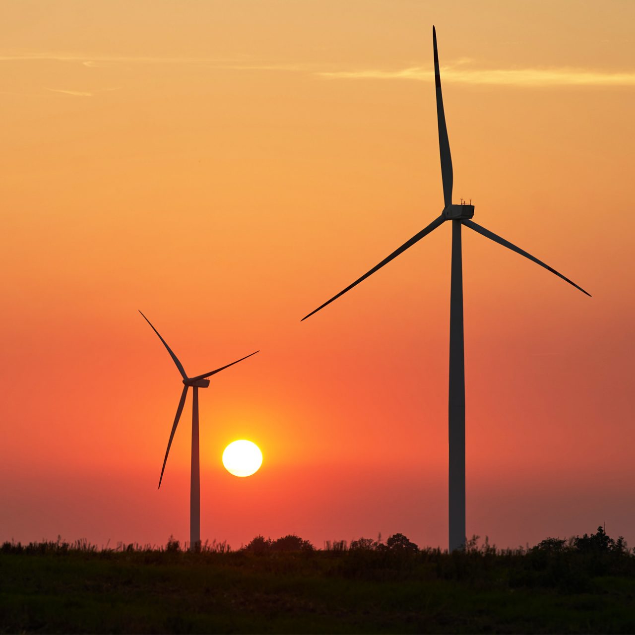 Onshore wind turbines at sunrise