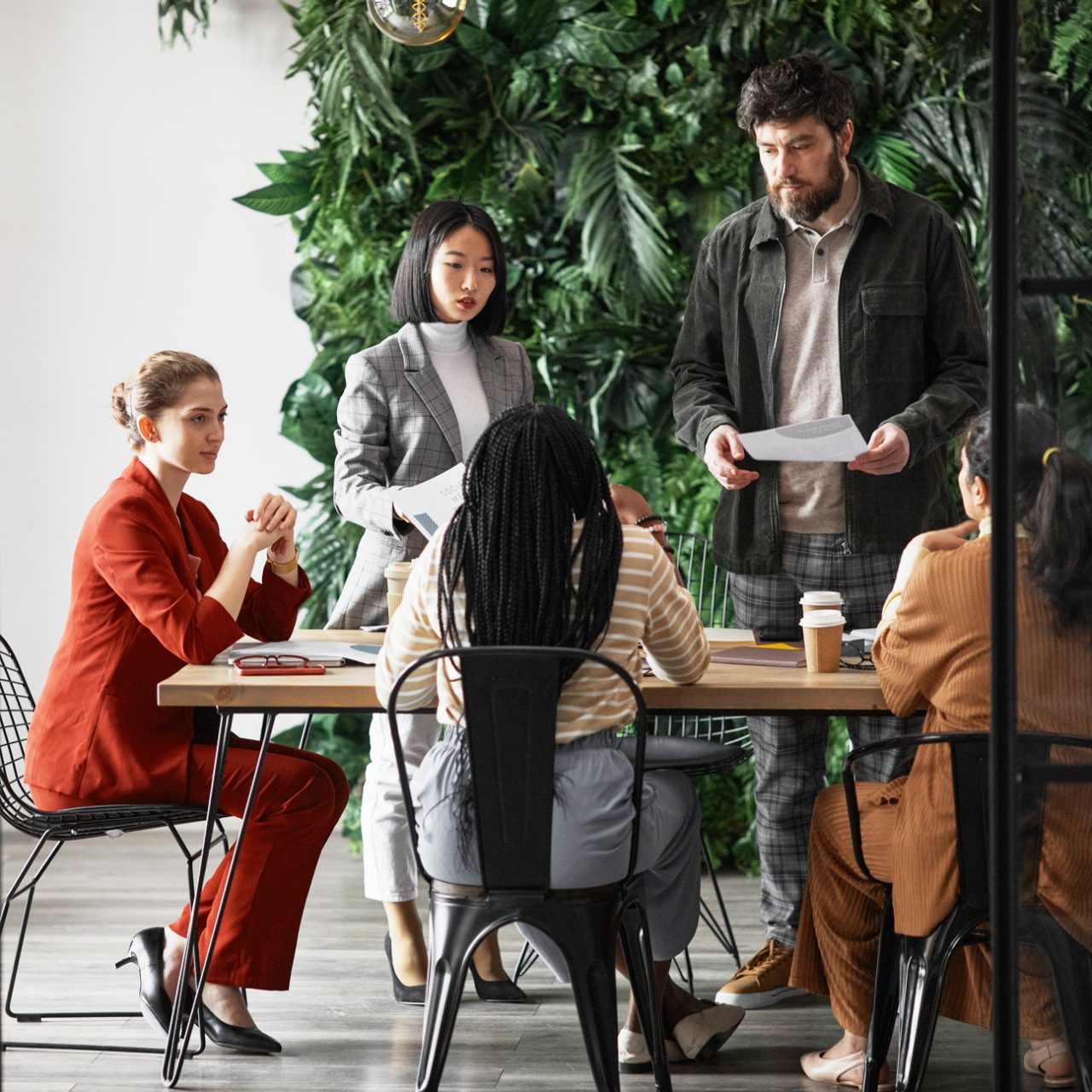 Group of people in conversation around a table