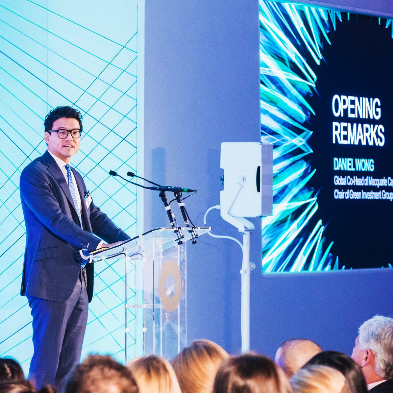 Man speaking at podium at event