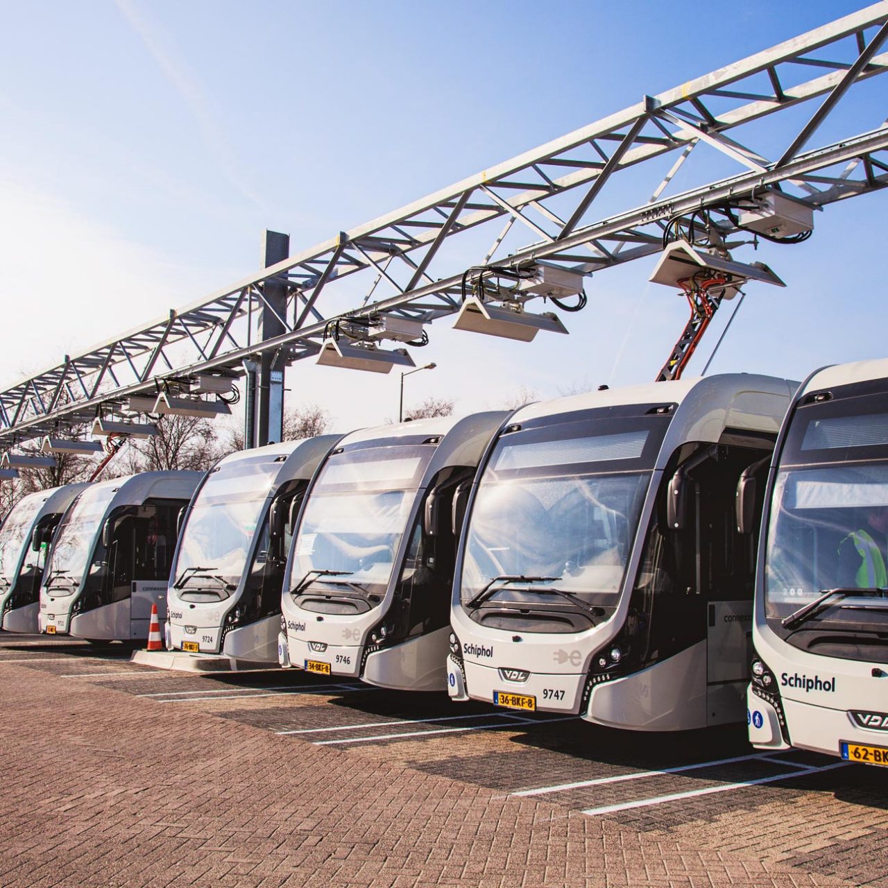 Fleet of electric buses with overhead charging equipment