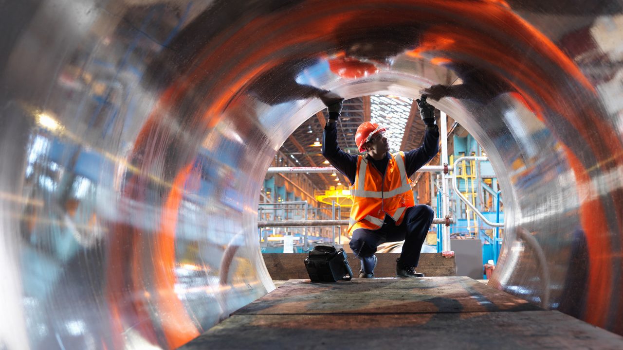 Steel pipe with worker